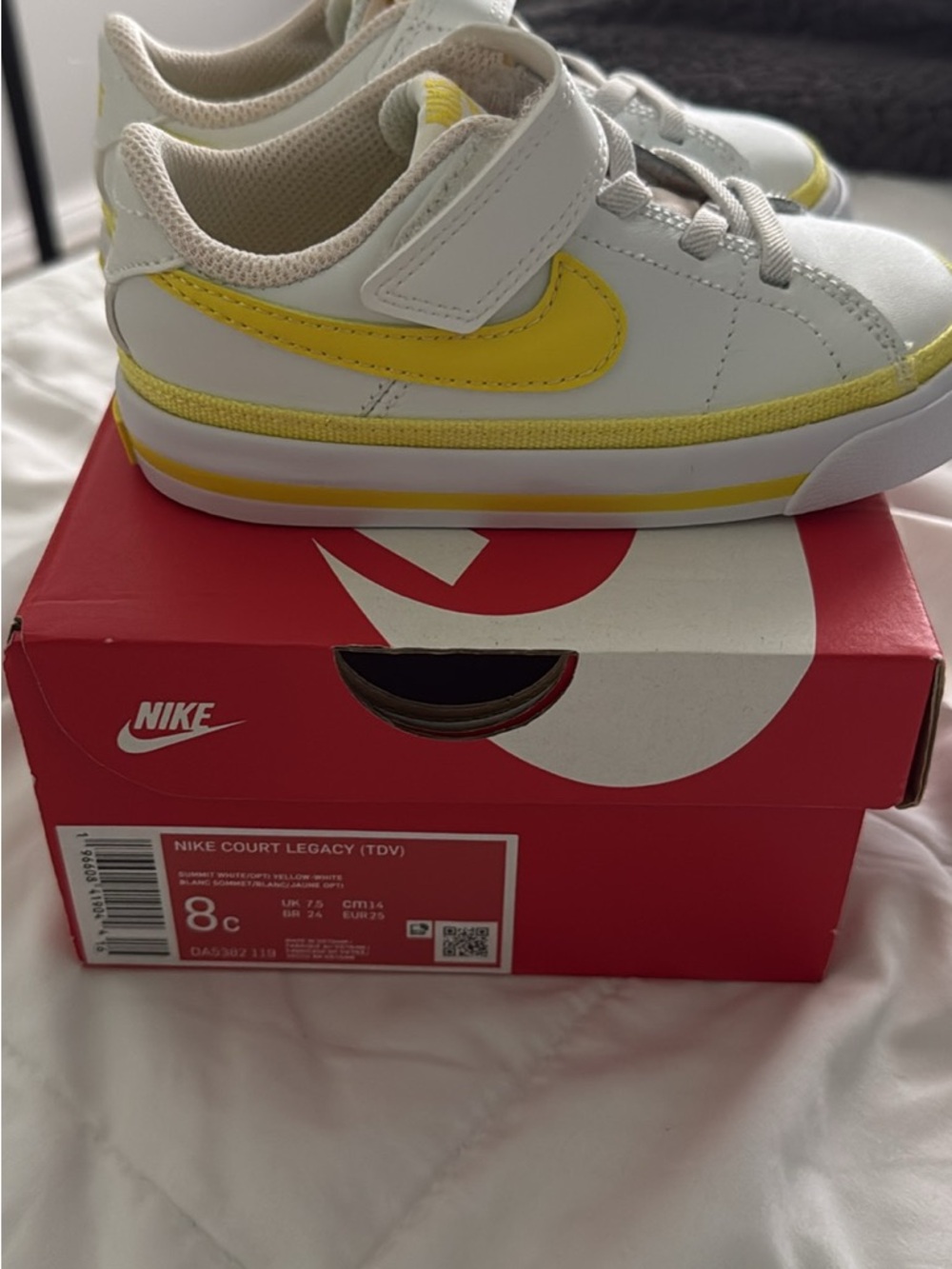 Nike Kids White Sneakers with Yellow Swoosh